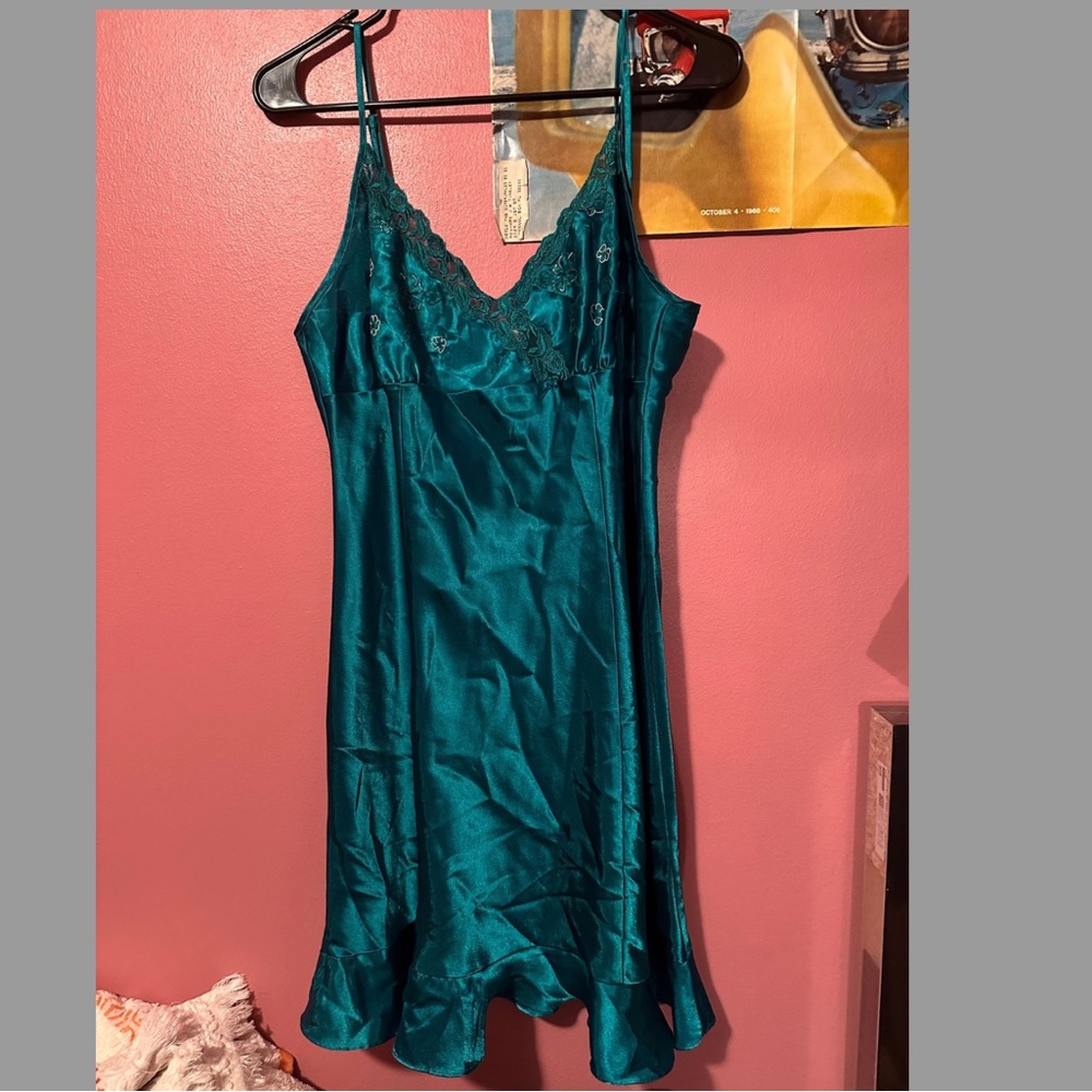 Satin dress with lace, floral embroidery, and a small bow. Adjustable straps